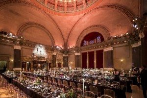 Clear chairs complement wedding decor and lighting at a Weylin B. Seymour's wedding
